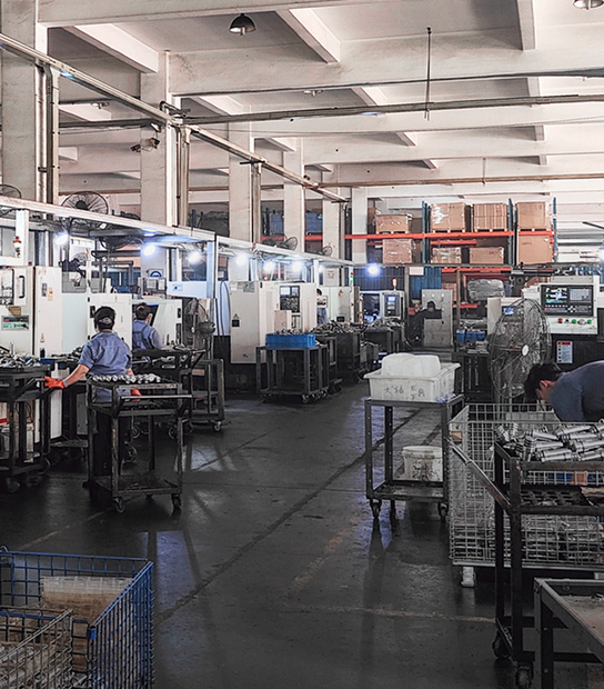 Metalworking workshop with workers and production equipment